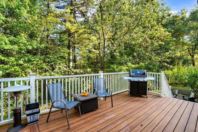 wooden terrace with area for grilling