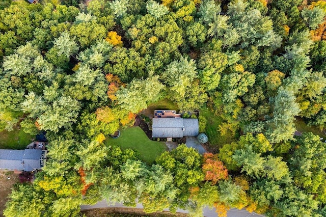 birds eye view of property featuring a wooded view