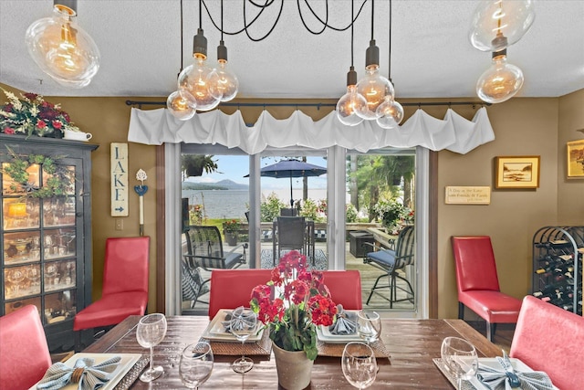 dining space featuring a textured ceiling