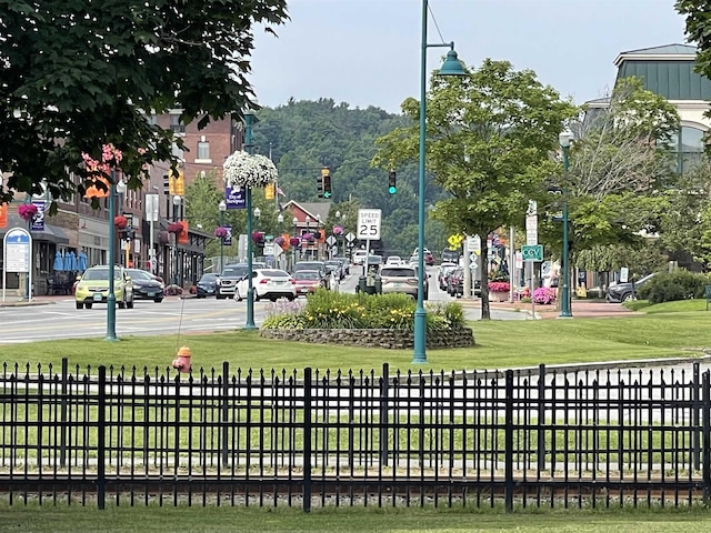 view of home's community with fence