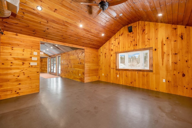 additional living space featuring vaulted ceiling, wood walls, wooden ceiling, and concrete flooring