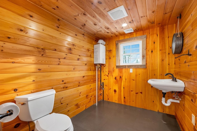 half bathroom featuring toilet, wooden ceiling, visible vents, and wood walls