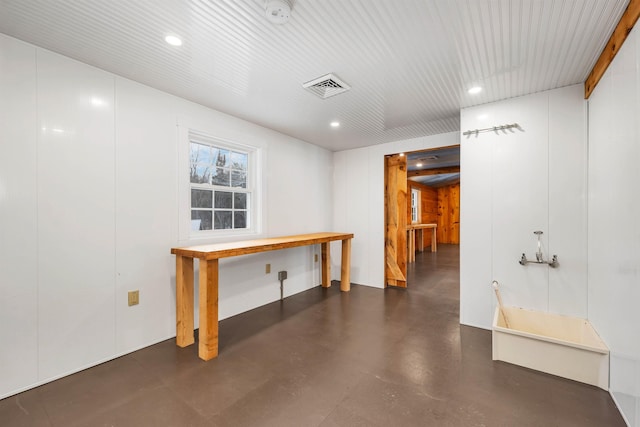 interior space featuring concrete floors, visible vents, and recessed lighting