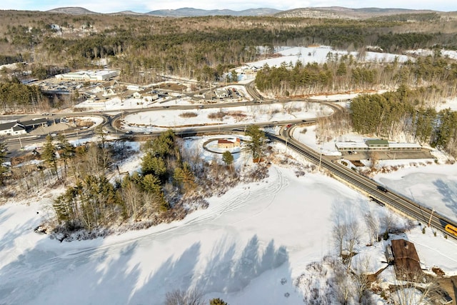 snowy aerial view featuring a mountain view