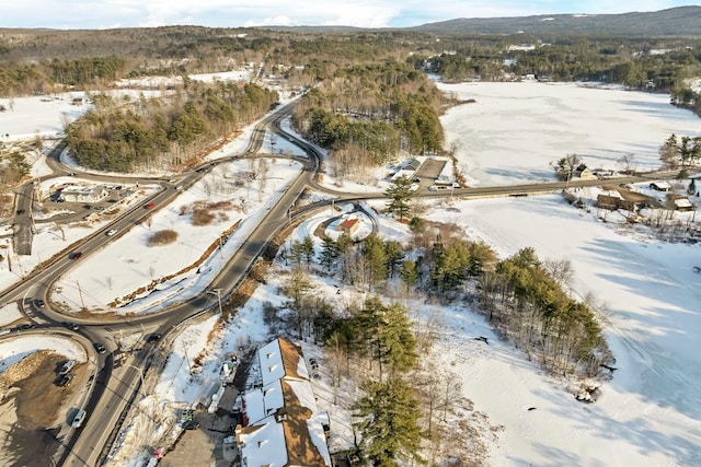 snowy aerial view featuring a mountain view