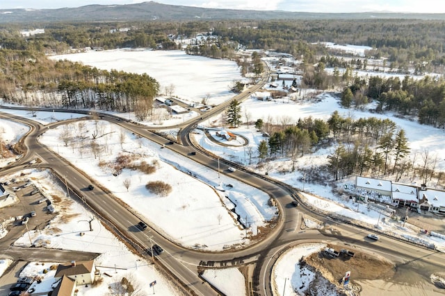 snowy aerial view with a mountain view