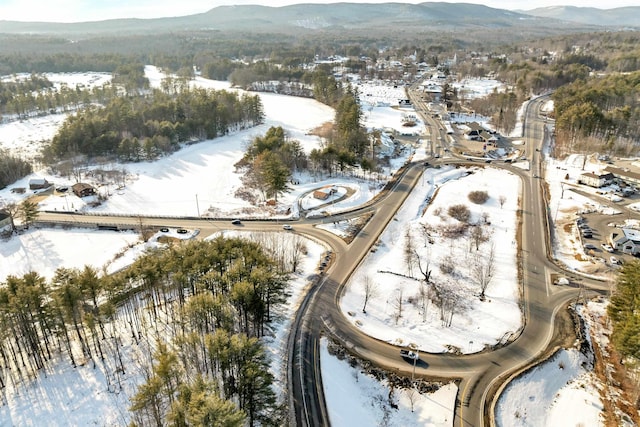 snowy aerial view featuring a mountain view