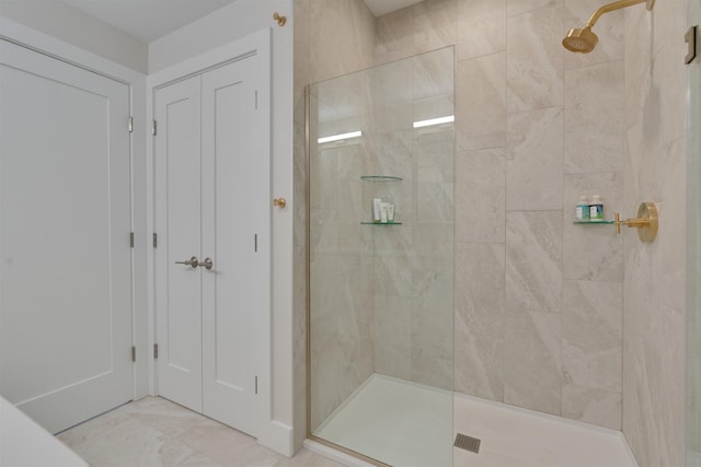 full bathroom with a tile shower