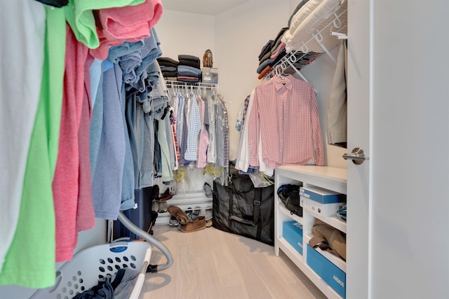 spacious closet featuring wood finished floors