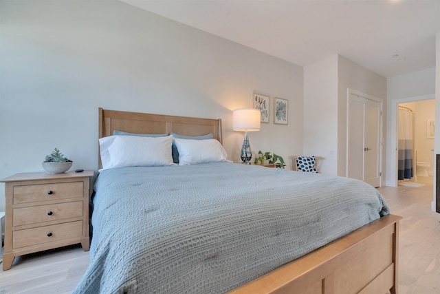 bedroom with light wood finished floors