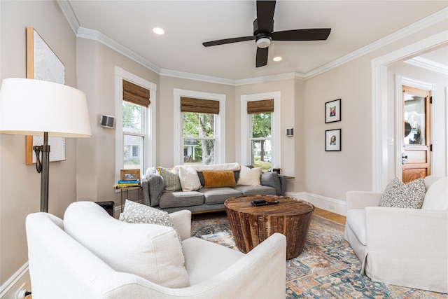 living room with crown molding, recessed lighting, a ceiling fan, wood finished floors, and baseboards