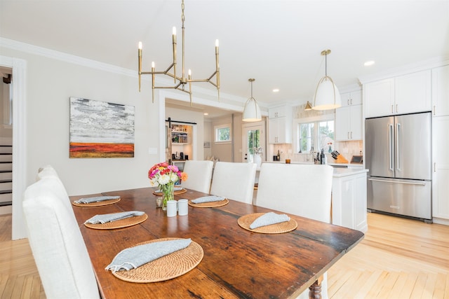 dining space with parquet floors, recessed lighting, and crown molding