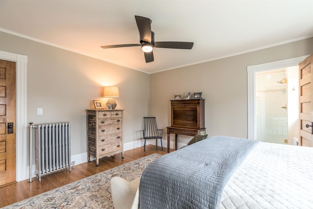 bedroom featuring ornamental molding, baseboards, radiator heating unit, and wood finished floors