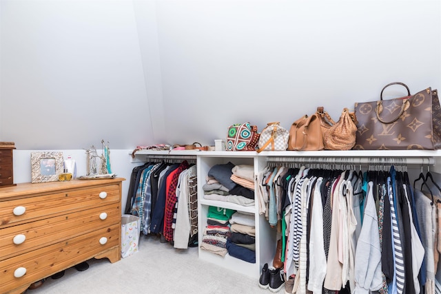 walk in closet featuring carpet