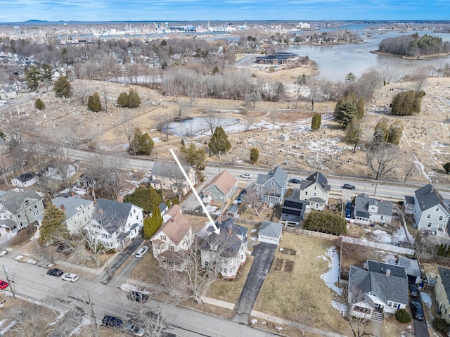 birds eye view of property featuring a residential view and a water view