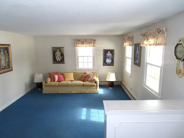 unfurnished living room with a textured ceiling, baseboard heating, and baseboards