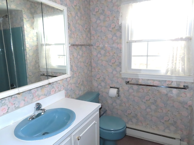 full bath featuring a shower, toilet, a baseboard heating unit, vanity, and wallpapered walls