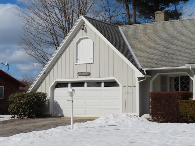 view of snow covered garage