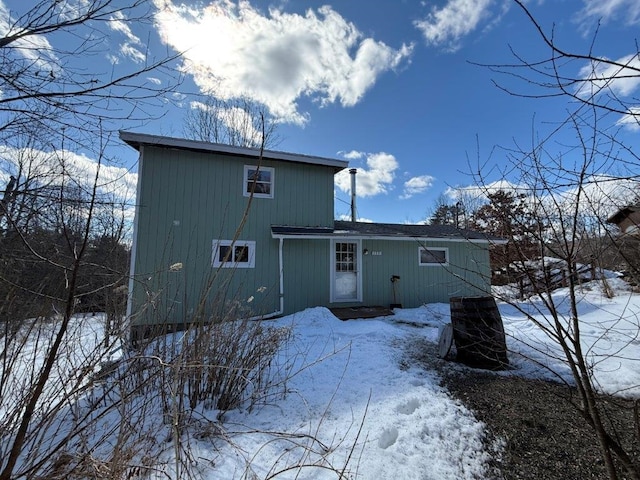 view of snow covered house