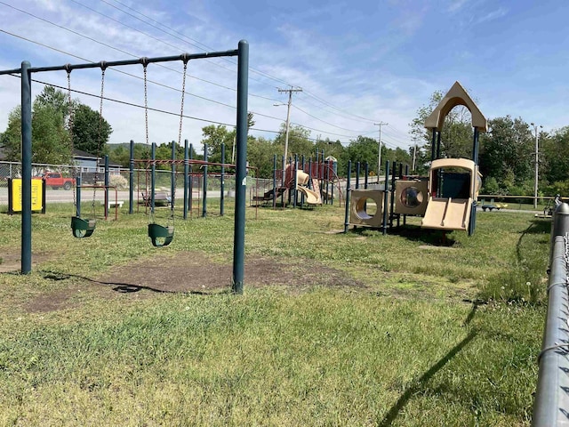 community playground featuring a lawn