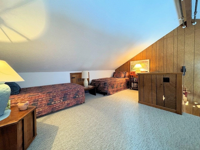 bedroom with lofted ceiling, carpet, and wooden walls