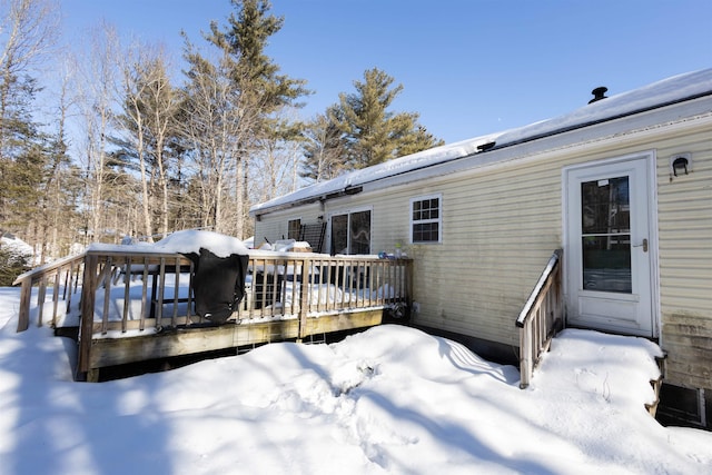 view of snow covered deck