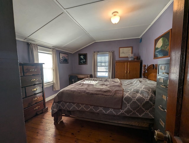 bedroom with lofted ceiling, baseboards, ornamental molding, and hardwood / wood-style floors