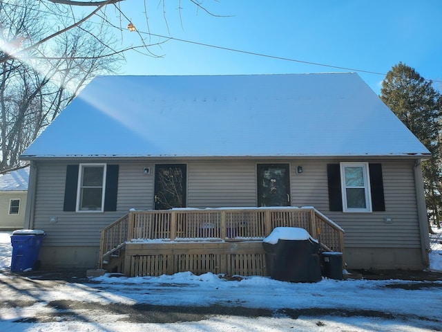 view of front of house featuring a deck and metal roof