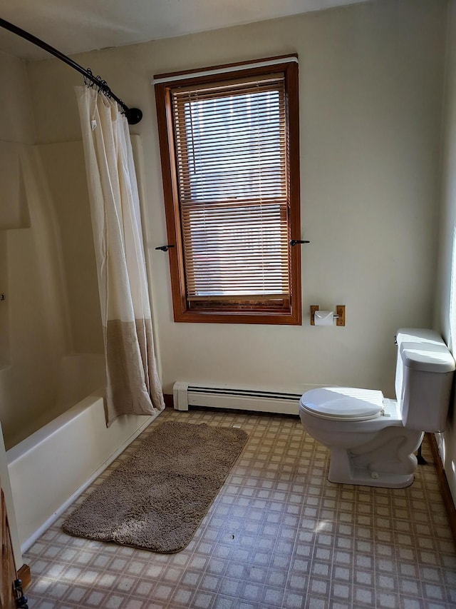 bathroom with a baseboard heating unit, shower / tub combo with curtain, toilet, and tile patterned floors