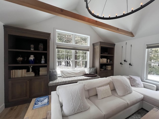 living area featuring light wood-style flooring and vaulted ceiling with beams