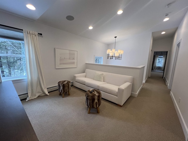 carpeted living room featuring baseboards, a baseboard radiator, recessed lighting, vaulted ceiling, and a notable chandelier