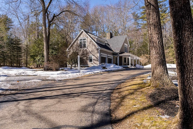 exterior space with aphalt driveway