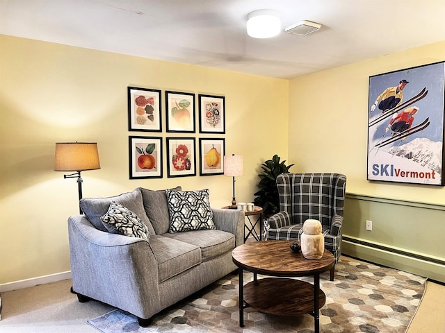 living area featuring baseboards and carpet flooring