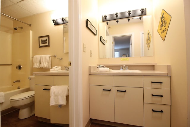 full bathroom featuring toilet, tub / shower combination, and vanity