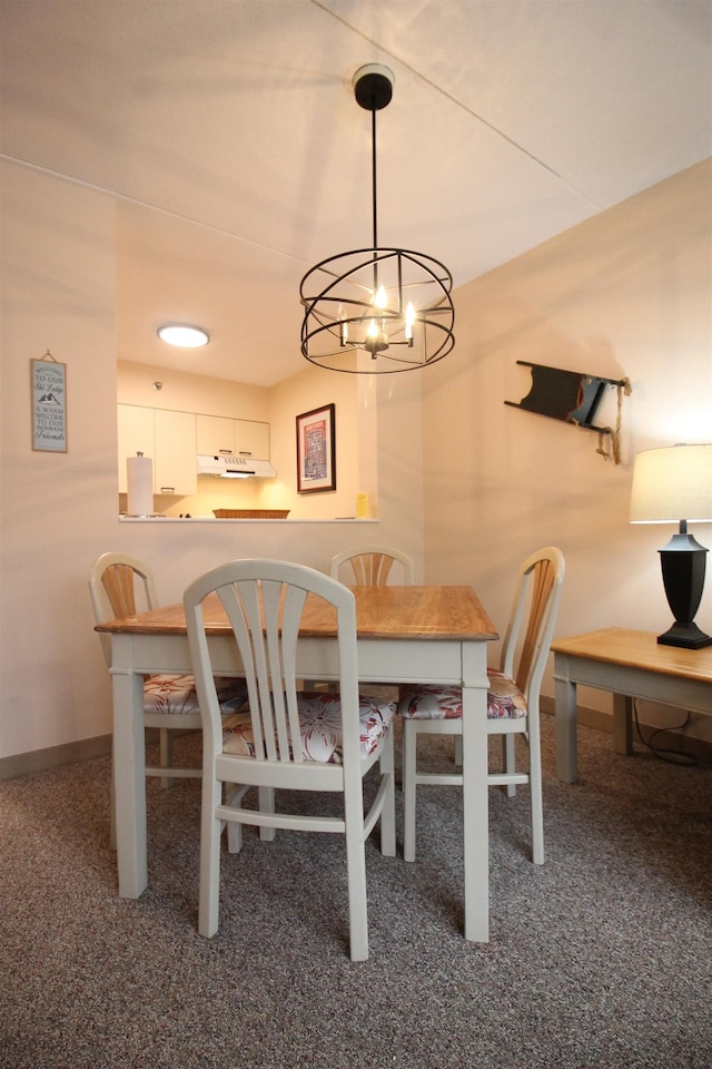 dining space with carpet and baseboards