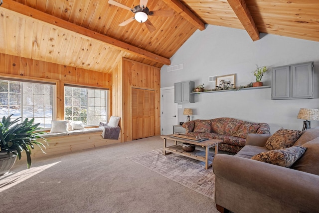 carpeted living area featuring beamed ceiling, high vaulted ceiling, ceiling fan, and wooden ceiling