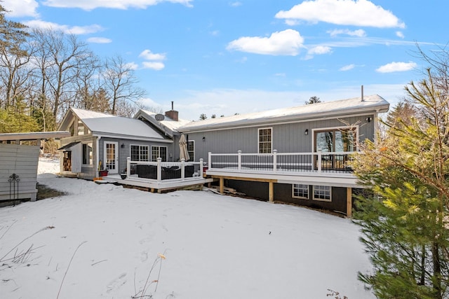 back of property featuring a wooden deck