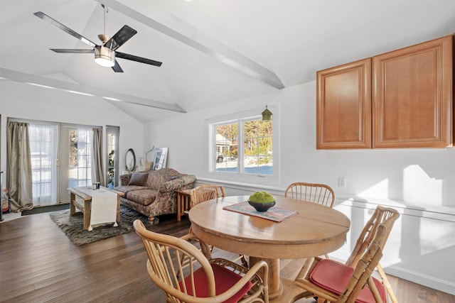 dining space featuring lofted ceiling, wood finished floors, and ceiling fan