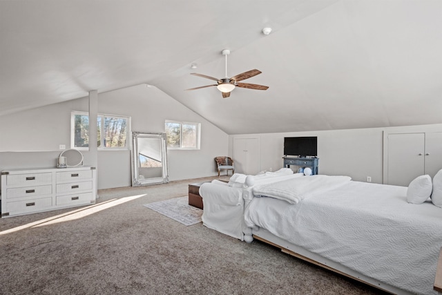 bedroom with lofted ceiling, carpet flooring, and a ceiling fan