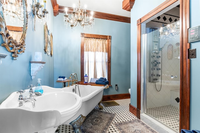 bathroom with a soaking tub, toilet, a sink, a shower stall, and tile patterned floors