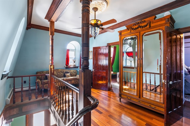 bedroom with ornamental molding and wood-type flooring