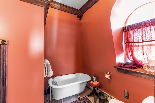 bathroom featuring ornamental molding and a soaking tub