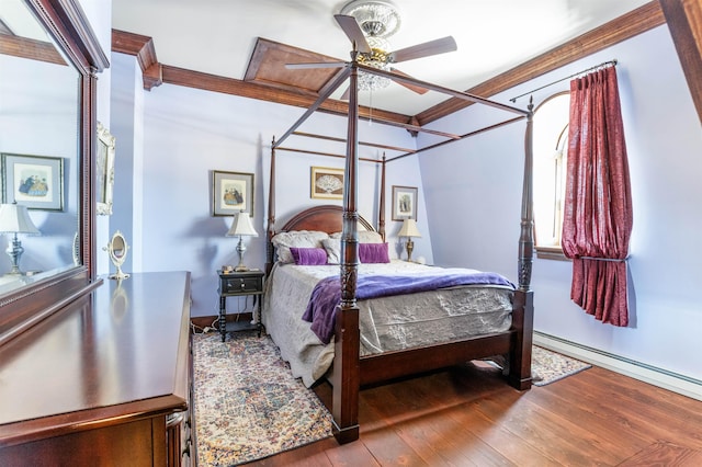 bedroom with hardwood / wood-style flooring, a baseboard radiator, and crown molding