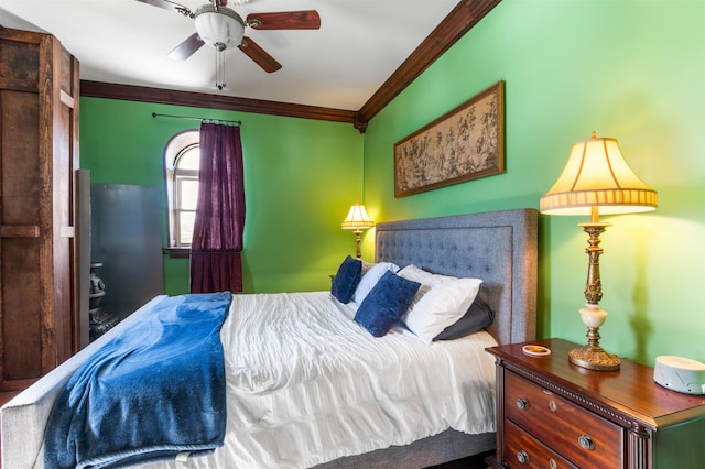 bedroom with ceiling fan and crown molding