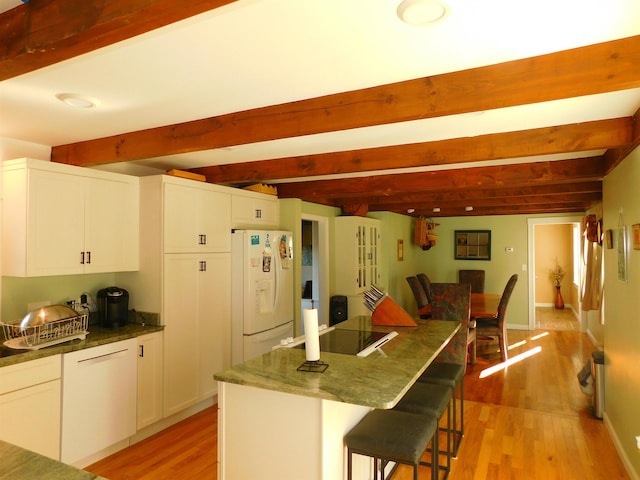 kitchen with white fridge with ice dispenser, light wood-type flooring, beamed ceiling, and black electric stovetop