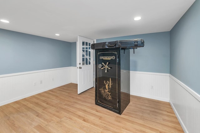 26 Hilltop Dr, Wakefield, NH 03872 - detailed view of wainscoting, wood finished floors, and recessed lighting