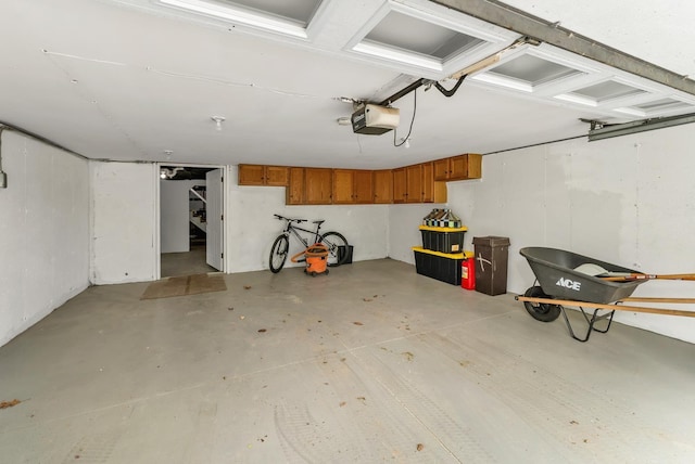 26 Hilltop Dr, Wakefield, NH 03872 - garage featuring a garage door opener