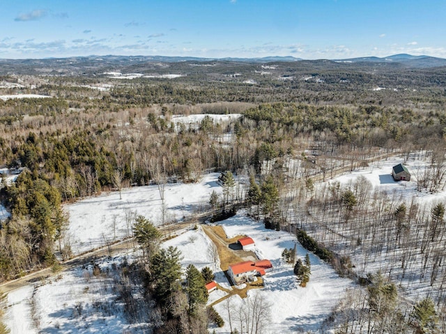 snowy aerial view with a mountain view