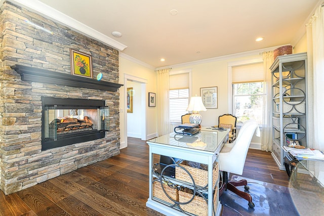 office with baseboards, a fireplace, ornamental molding, and wood finished floors