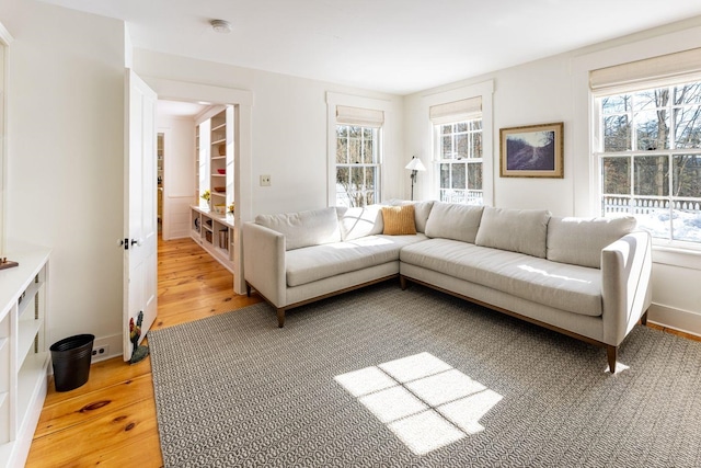 living room with light wood-style floors and baseboards